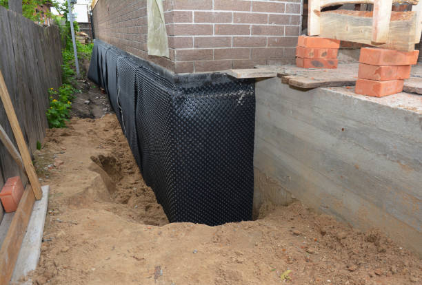 SJ Waterproofing Pros technician performing targeted Basement Waterproofing assessment in Niles, MI